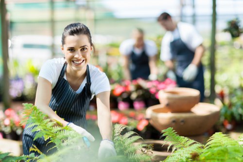 Volunteers and charity partners receiving donated plants and soil